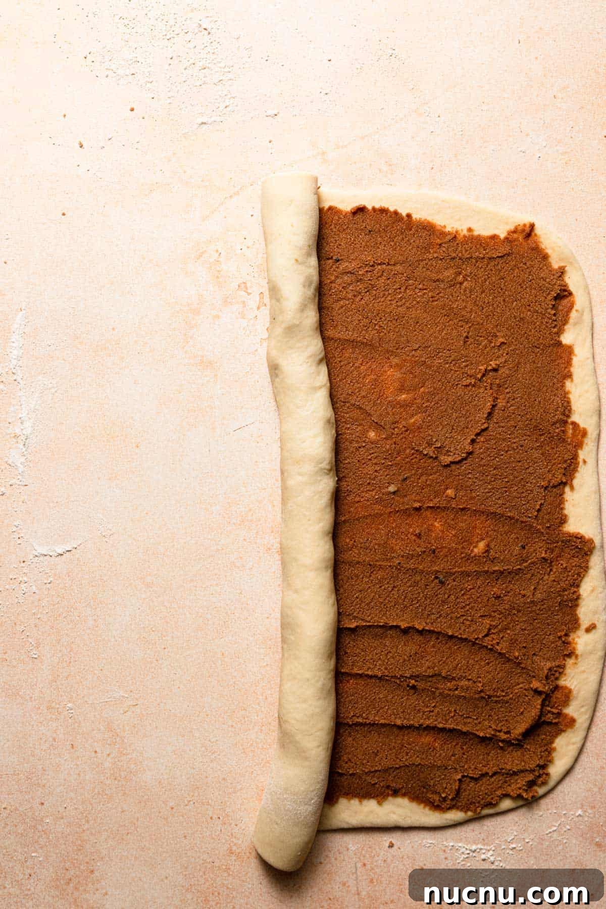 Rolling dough from the long side.