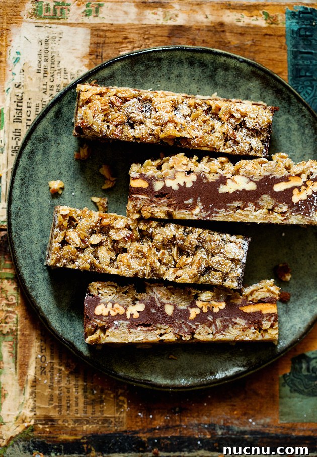 Chewy Coconut Oatmeal Chocolate Bars Recipe 4 Coconut Oatmeal Chocolate Bars via Bakers Royale