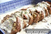 How to Make Extra-Crispy Roasted Potatoes 11 a blue polish pottery dish with stuffed meatloaf in it.