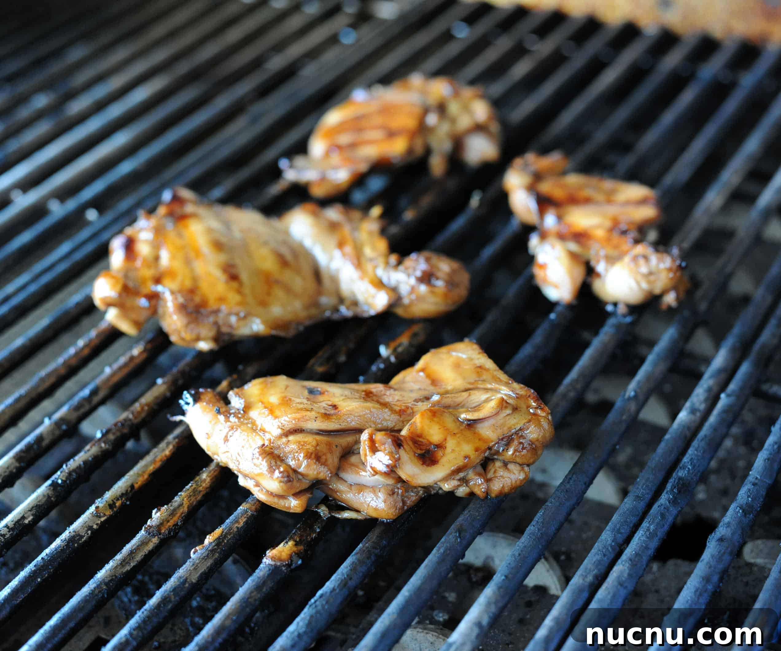 Grilled Pad Thai Recipe: Smoky Stir-Fried Noodles with Shrimp and Peanuts 3 chicken thighs on grill.