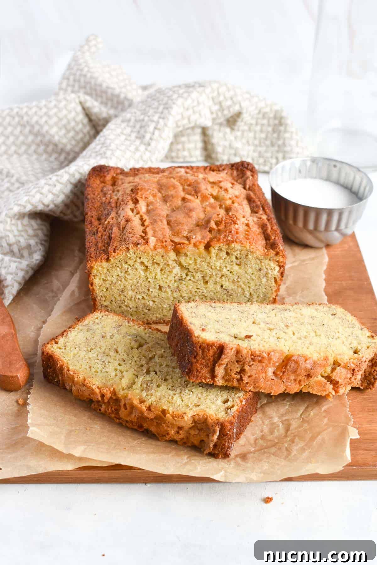 Moist Banana Bread Without Baking Soda: Simple Oven Recipe 2 banana bread loaf with two slices of bread in front.