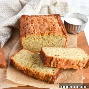Moist Banana Bread Without Baking Soda: Simple Oven Recipe 17 banana bread loaf with slices in front of it.