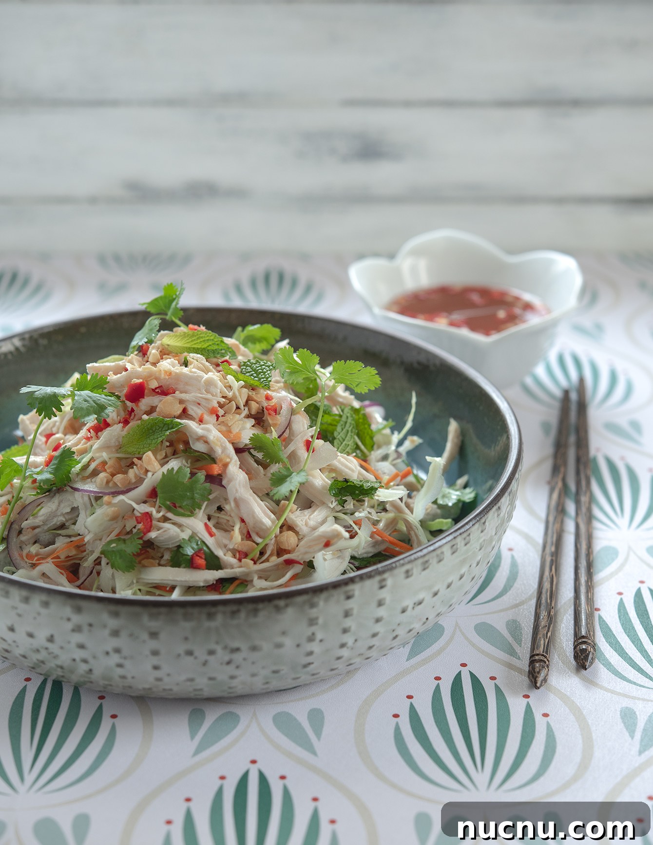Authentic Vietnamese Shredded Chicken Salad (Gà Xé Phay) 2 Plated Vietnamese chicken salad topped with fresh cilantro and mint