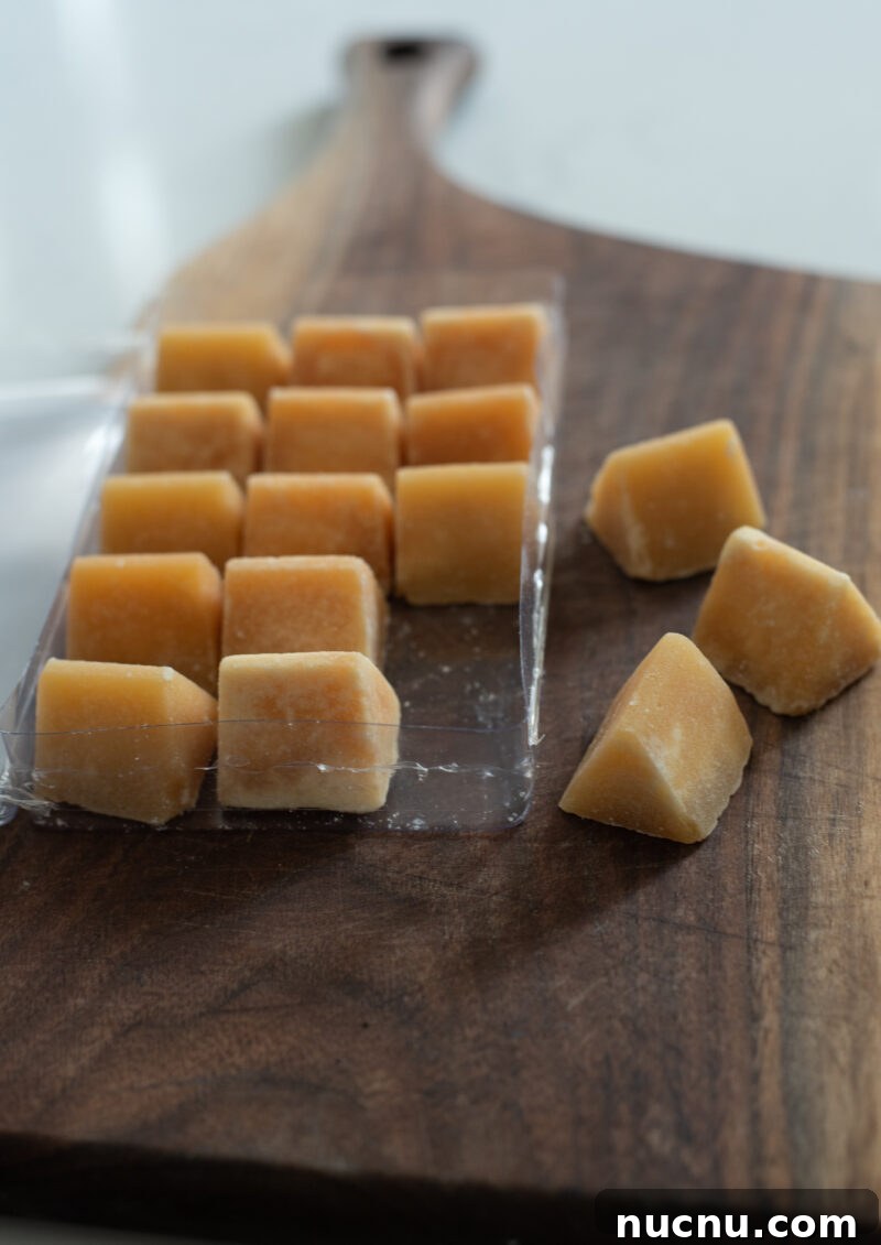 Authentic Vietnamese Shredded Chicken Salad (Gà Xé Phay) 4 Palm sugar cubes arranged on a wooden board