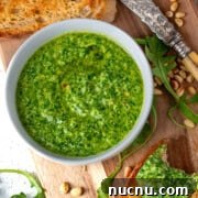 Arugula Pesto: Quick Recipe for Peppery Homemade Sauce 8 Arugula pesto, also known as rocket pesto, served with toasted ciabatta.