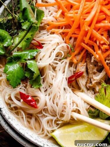 close up overhead shot of instant pot chicken pho in a bowl