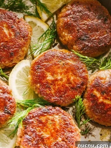 Salmon patties with dill and lemons.