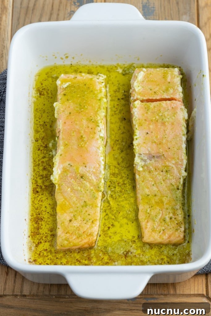 Pesto Butter Salmon with 3 Ingredients — Quick Weeknight Recipe 8 flipping pesto butter salmon to finish baking in the oven