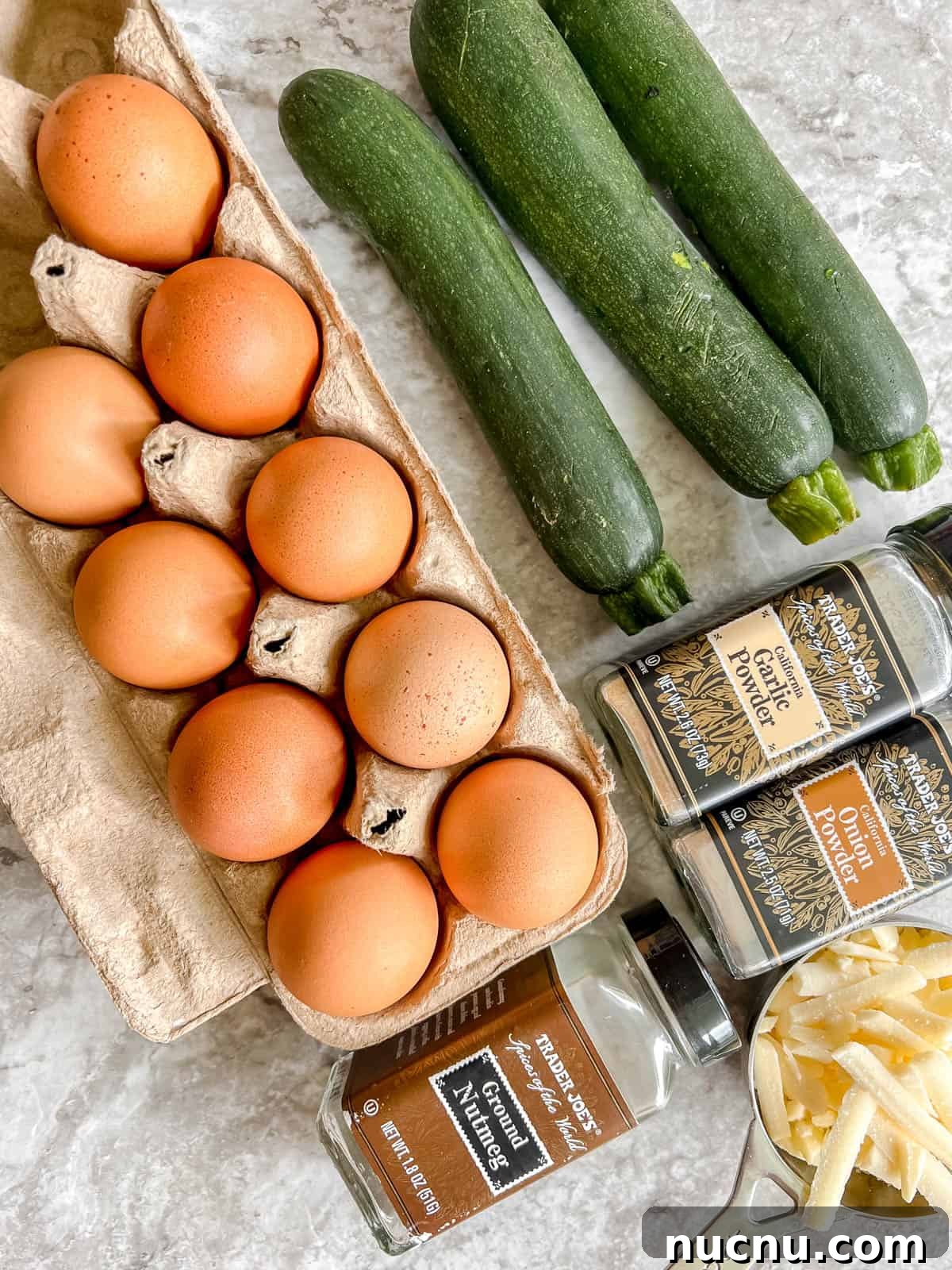 Zucchini Egg Muffin Cups: Protein-Packed Breakfast Bites 4 Ingredients needed to make Zucchini Egg Muffin Cups.