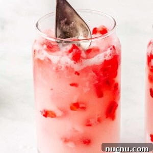 Strawberry Breeze Cocktail Copycat Recipe: Refreshing Homemade Drink 15 Coconut creme and strawberry puree stired in the glasses.