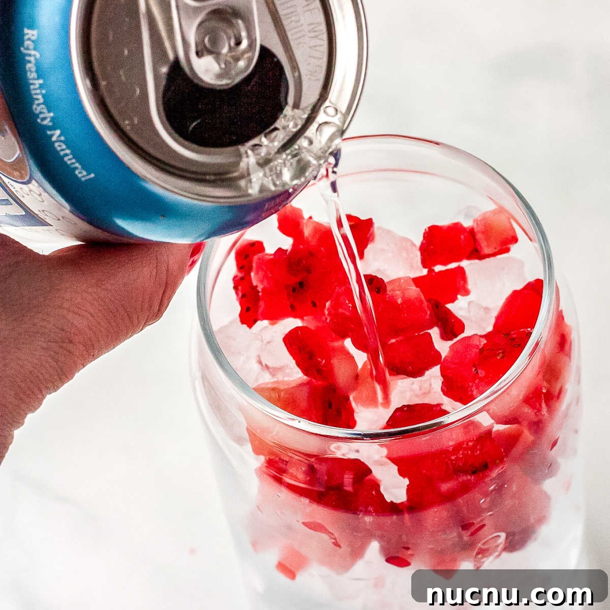 Strawberry Breeze Cocktail Copycat Recipe: Refreshing Homemade Drink 6 Seltzerbring poured into a clear drinking glass.