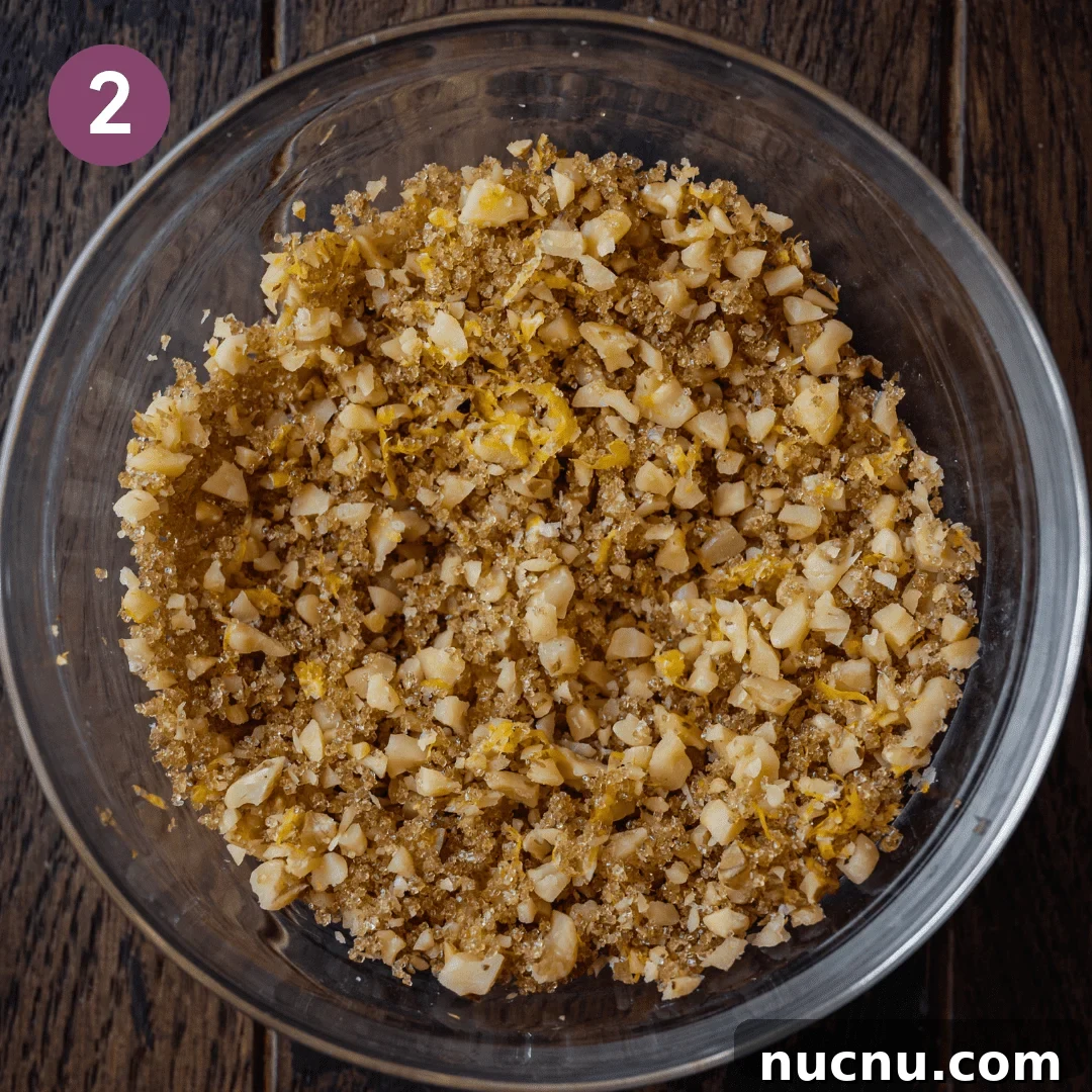 Vegan Blueberry Muffins Recipe: Moist, Fluffy, Simple to Make 6 brown sugar-walnut topping in bowl on wooden board.