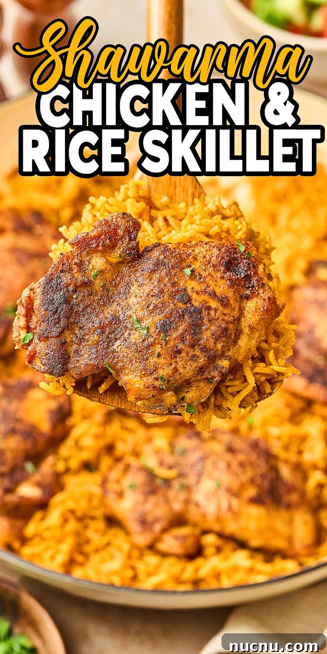 One-Pan Shawarma Chicken and Rice Skillet Recipe 21 A Shawarma Chicken and Rice Skillet with a spoon lifting a seasoned chicken thigh and fluffy rice, bursting with Middle Eastern flavors.