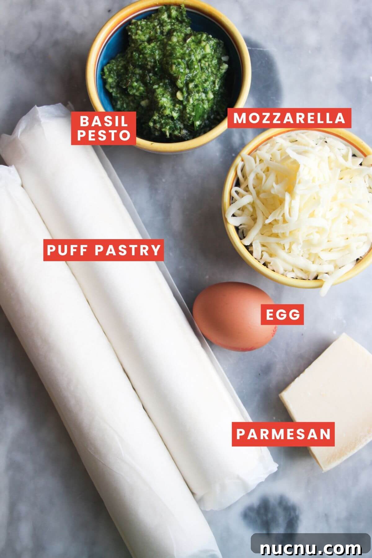Ingredients for pesto puff pastry Christmas trees laid out and labelled.