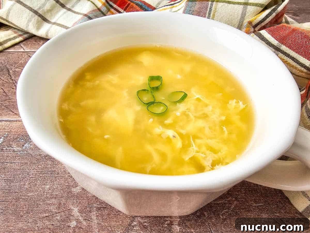 Classic Comfort: Homemade Egg Drop Soup Recipe 3 Egg Drop Soup in white bowl