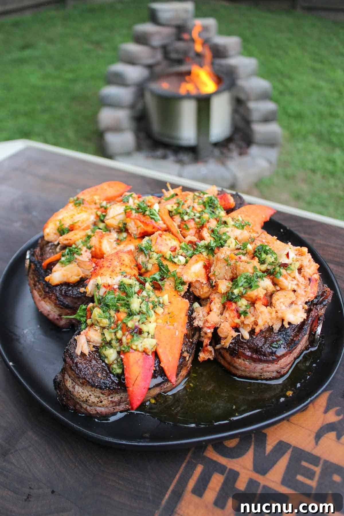 The butter is slathered over bacon-wrapped steaks and lobster meat. 