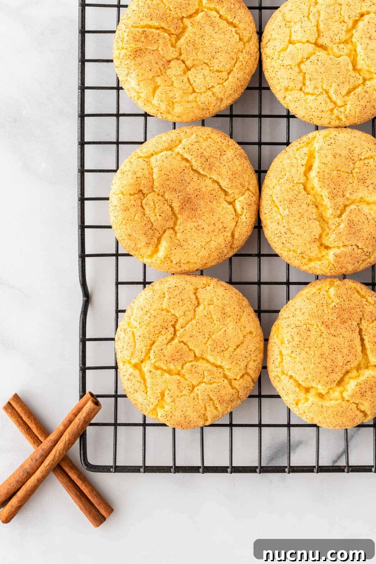 snickerdoodles cooling on a wire cooling rack