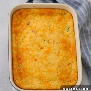 cheesy jalapeno corn casserole in an 8x10 baking dish.