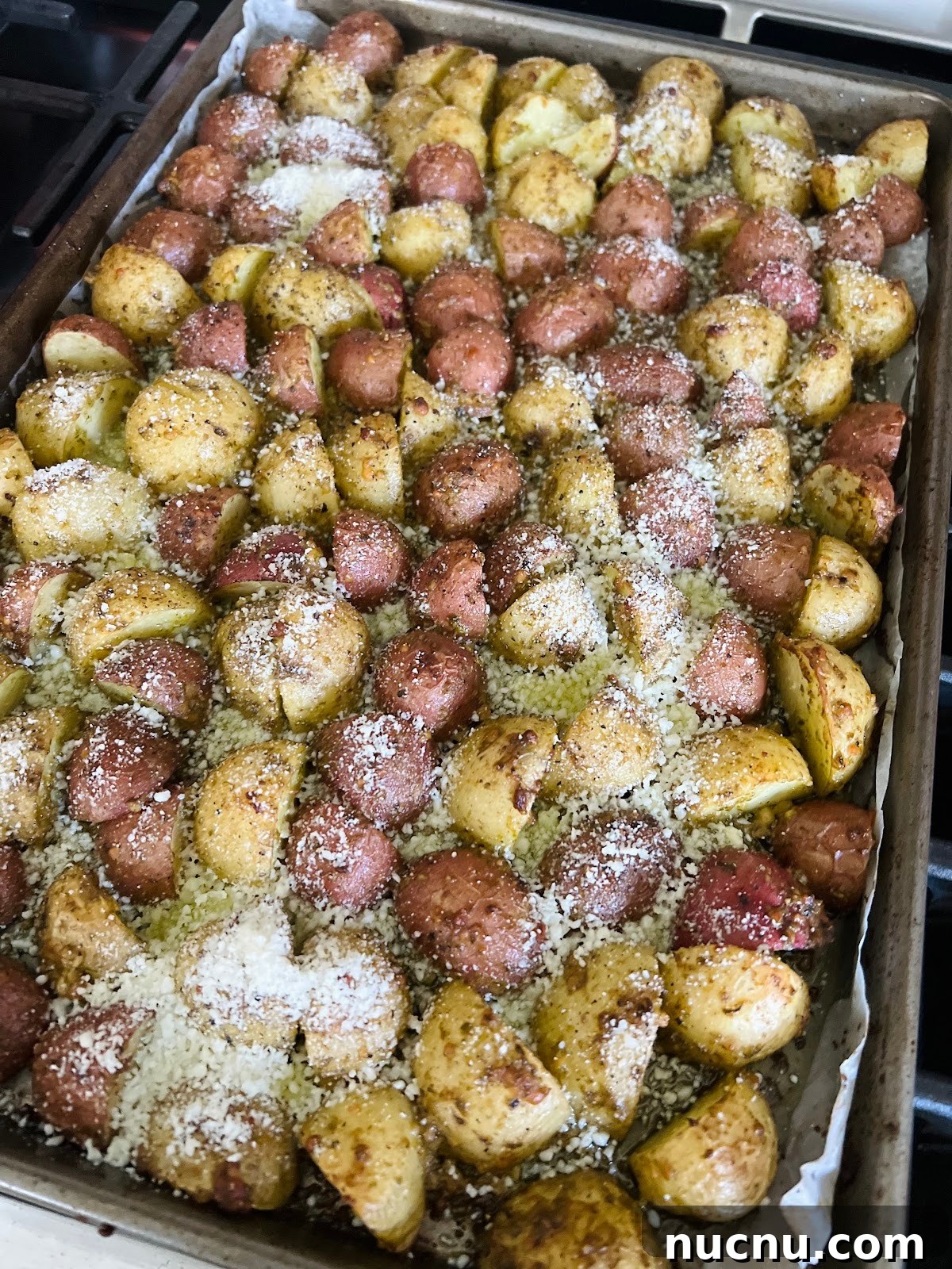 Crispy Pesto-Roasted Potatoes with Garlic and Parmesan 12 Pesto Potatoes on Sheet Pan Finished.