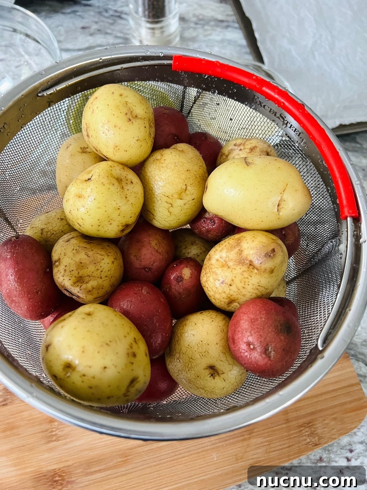 Crispy Pesto-Roasted Potatoes with Garlic and Parmesan 5 Potatoes in Colander.