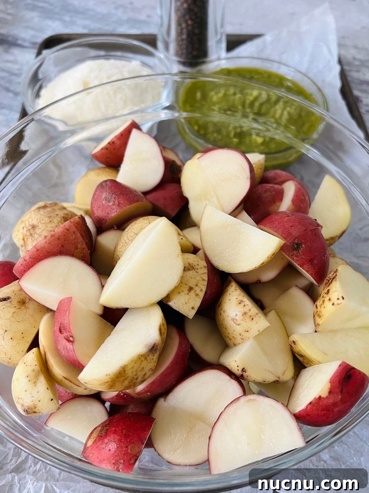 Crispy Pesto-Roasted Potatoes with Garlic and Parmesan 7 Potatoes in Bowl.