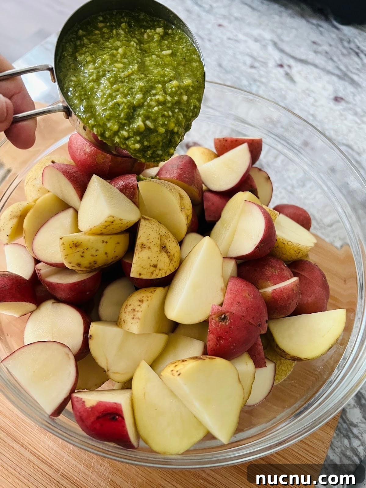 Crispy Pesto-Roasted Potatoes with Garlic and Parmesan 8 Pesto and Potatoes in Bowl.