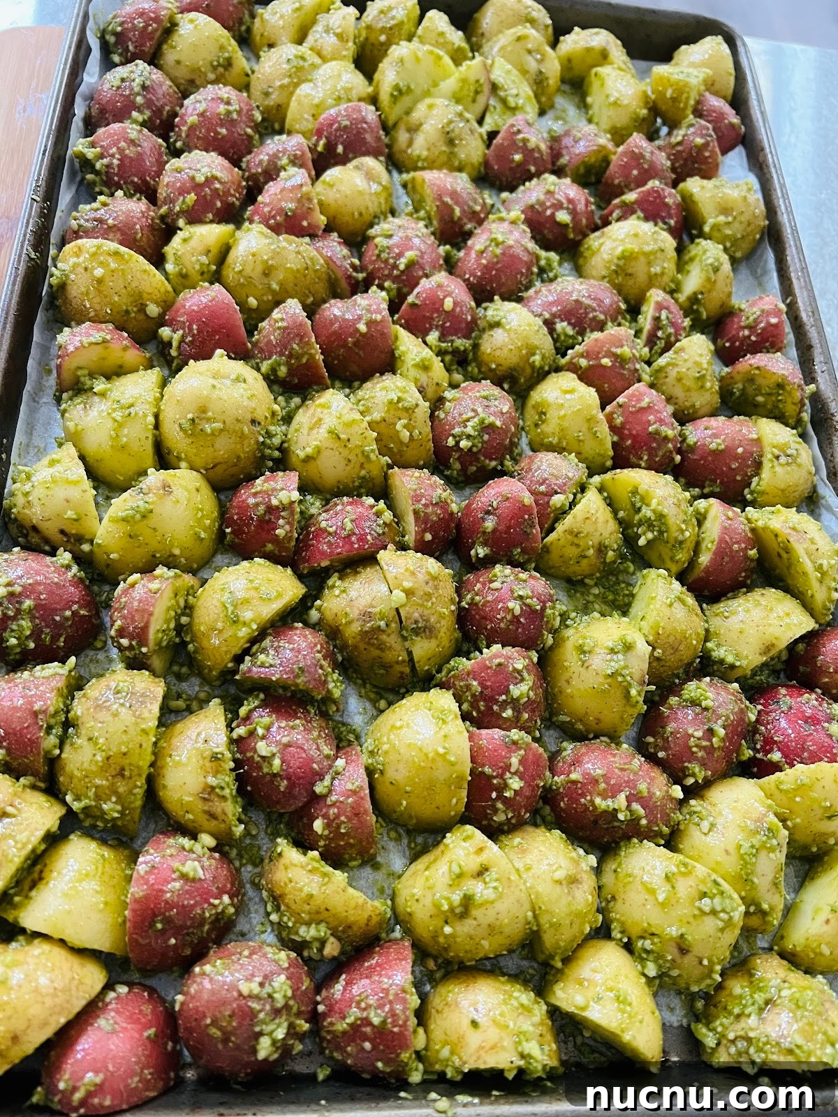 Crispy Pesto-Roasted Potatoes with Garlic and Parmesan 9 Pesto Potatoes on Sheet Pan.