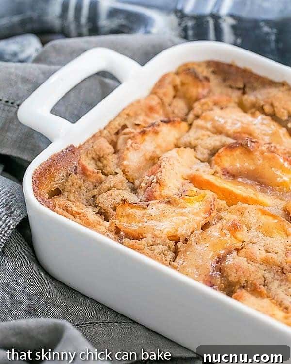 Fresh Peach Pudding - A self saucing peach dessert for a change from crisps and cobblers! Fresh Peach Pudding partial view in a white ceramic casserole