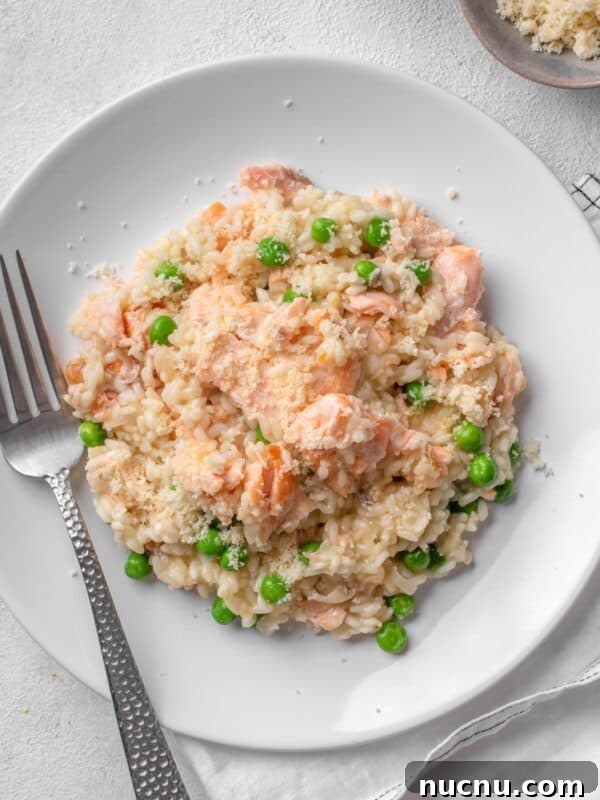 Creamy Chicken and Mushroom Risotto Recipe for Weeknight Dinner 14 salmon risotto with peas served on a white plate.