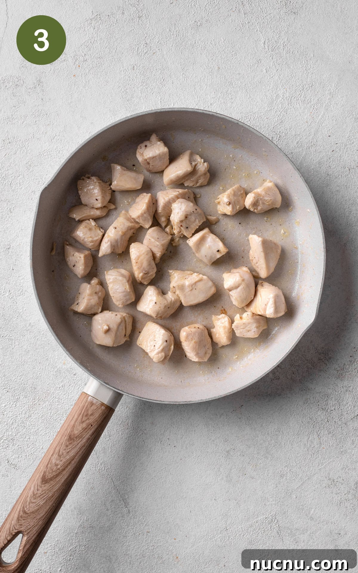 Creamy Chicken and Mushroom Risotto Recipe for Weeknight Dinner 6 frying chicken in a pan.