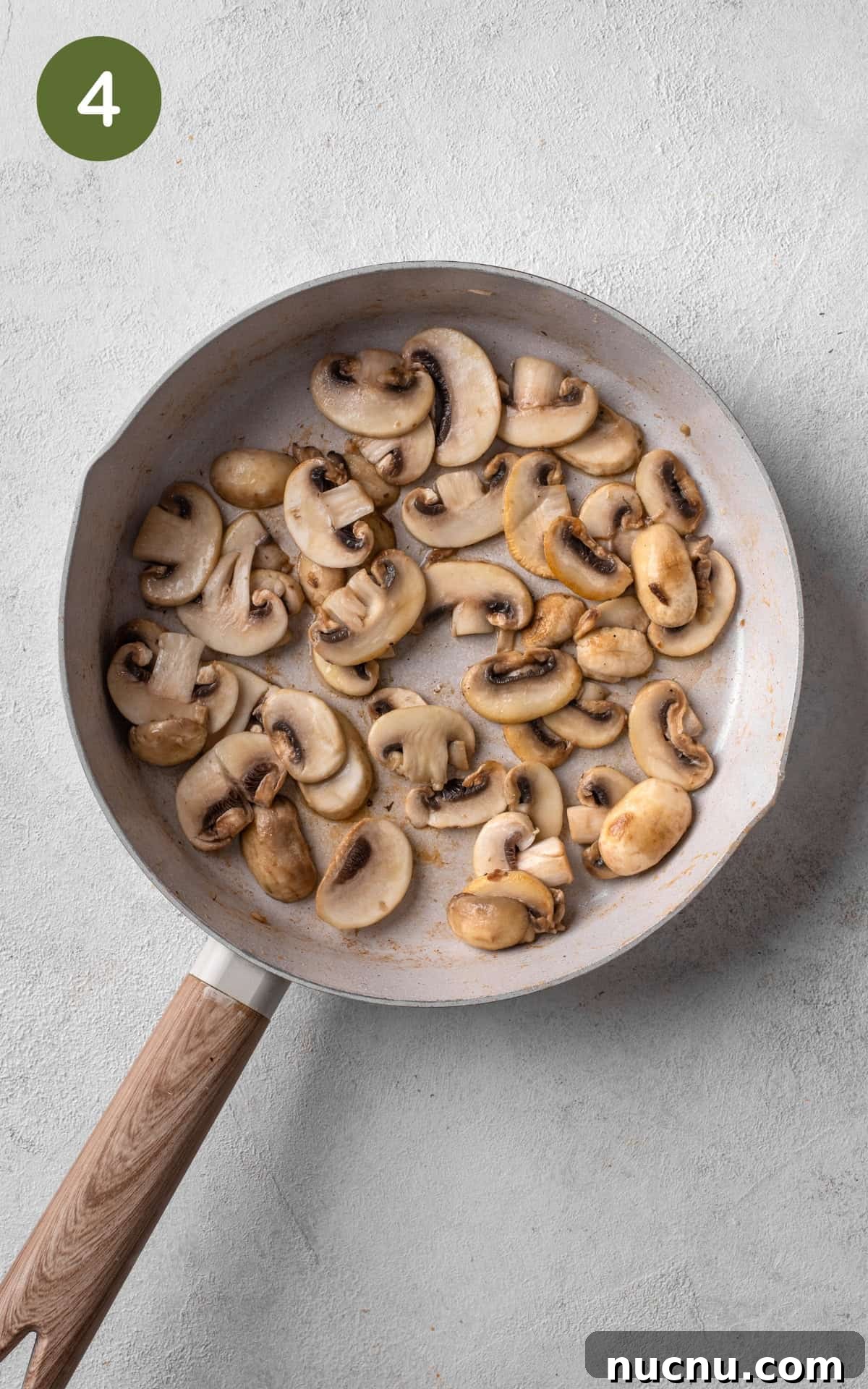 Creamy Chicken and Mushroom Risotto Recipe for Weeknight Dinner 7 cooking chicken and mushrooms in a skillet.