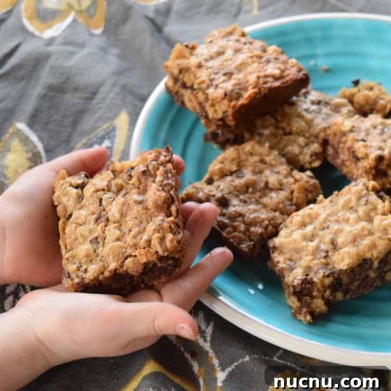 Child holding oatmeal chocolate chip bar