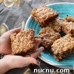 Child holding oatmeal chocolate chip bar