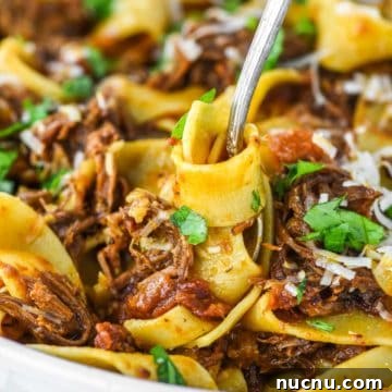 fork twirling pasta in bowl
