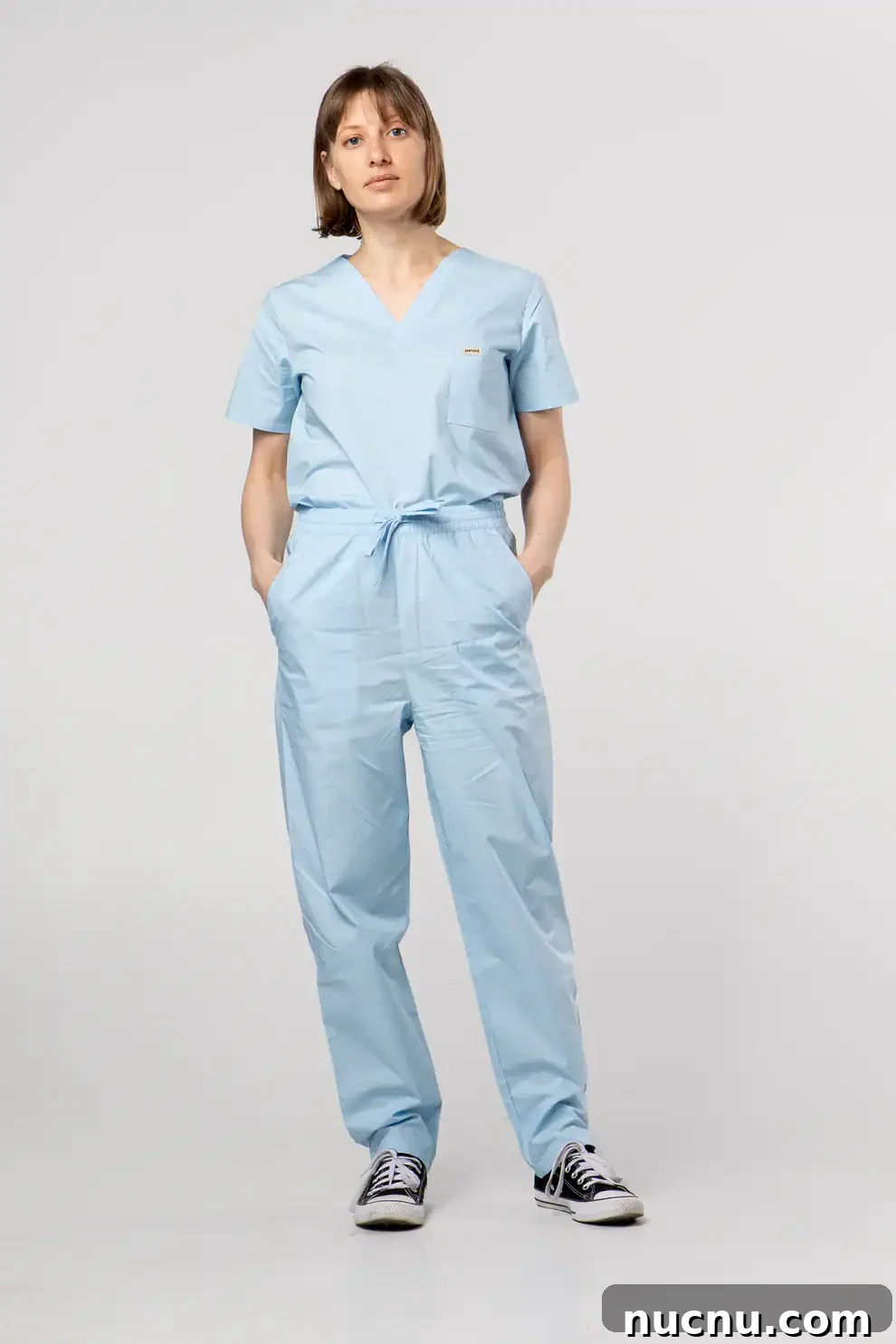 Searching for Organic Cotton Scrubs: My Frustrating Journey 5 Model wearing light blue Percent Apparel organic cotton jumpsuit scrub