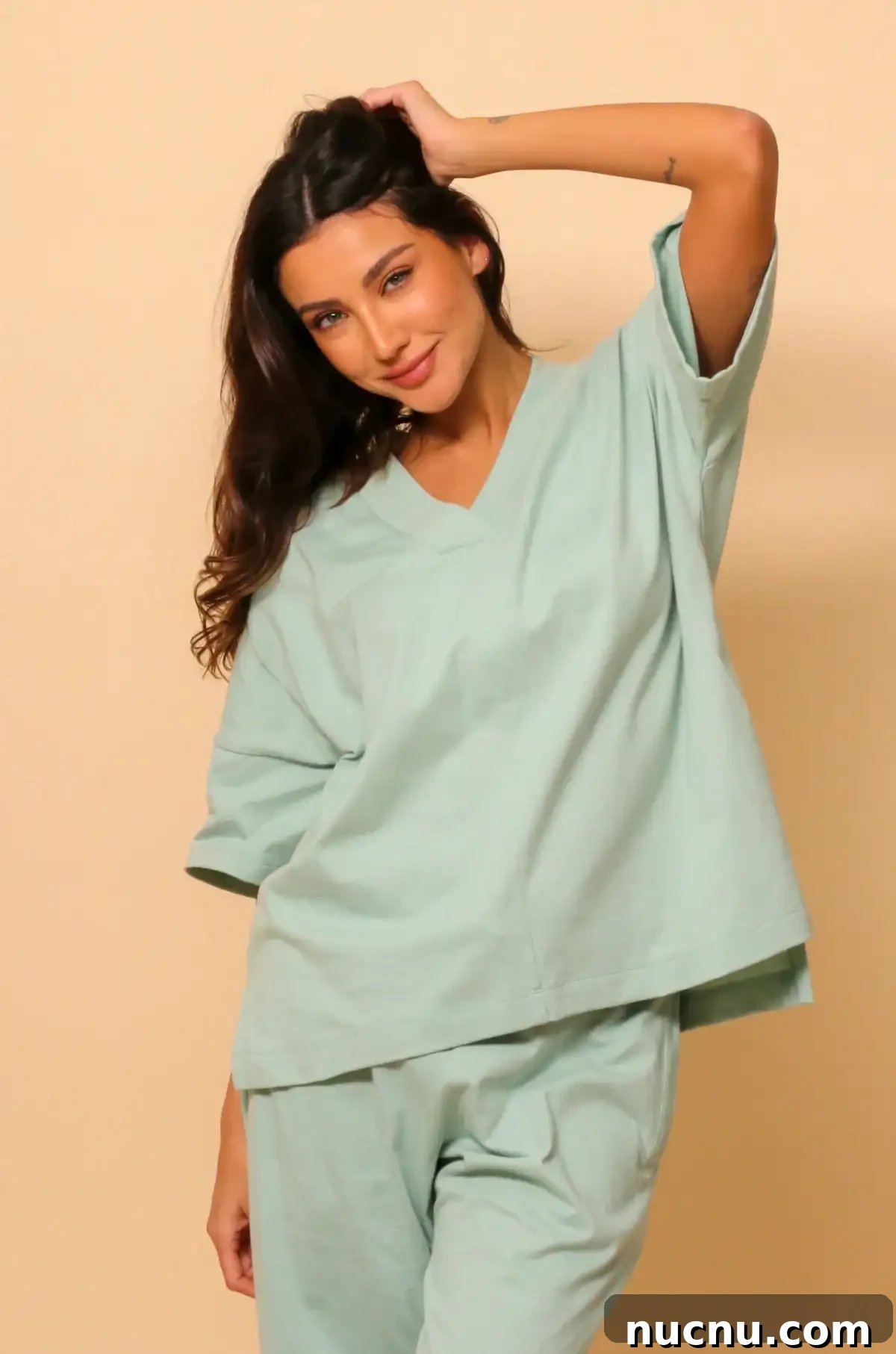 Searching for Organic Cotton Scrubs: My Frustrating Journey 6 Woman wearing light mint green Cottonique top and pants