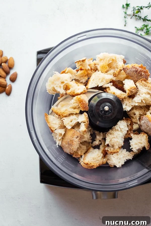 Chunks of stale bread in a food processor.