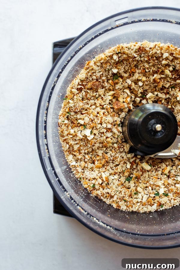 Almond bread crumbs in a food processor.