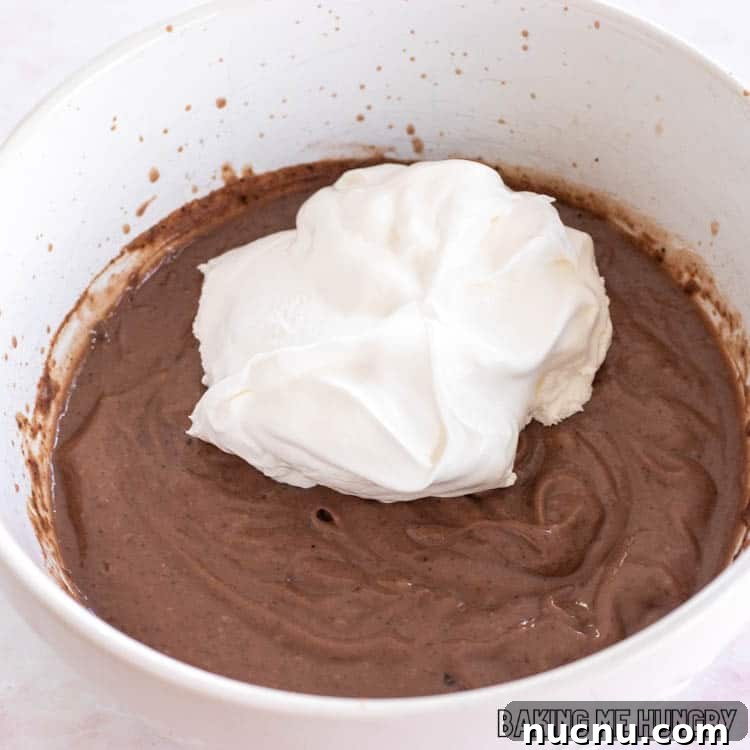 Decadent Chocolate Mud Pie Recipe: Creamy No-Bake Dessert 10 whipped topping on top of chocolate pudding on bowl
