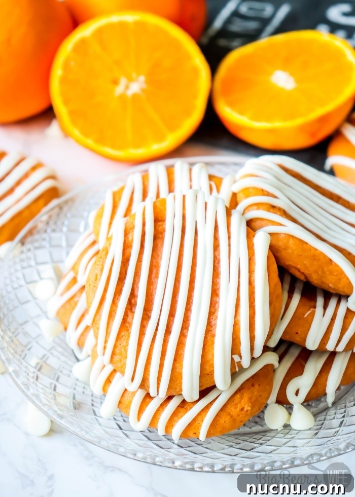 Orange Creamsicle Cookies Recipe — Light Citrus Sugar Cookies 4 Orange Creamsicle Cookies stacked on clear plate