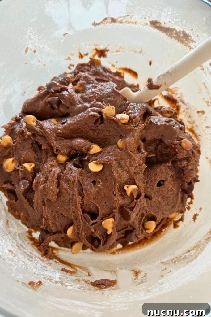 Cookie dough in a bowl for sourdough Halloween cookies.