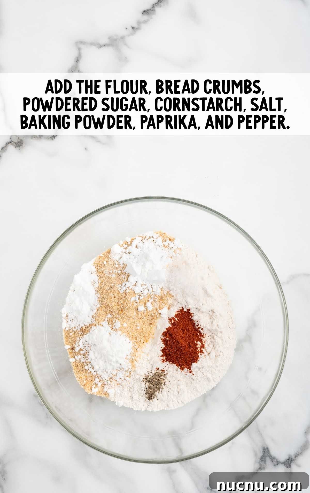flour, bread crumbs, powdered sugar, cornstarch, kosher salt, baking powder, paprika, and black pepper combined in a bowl