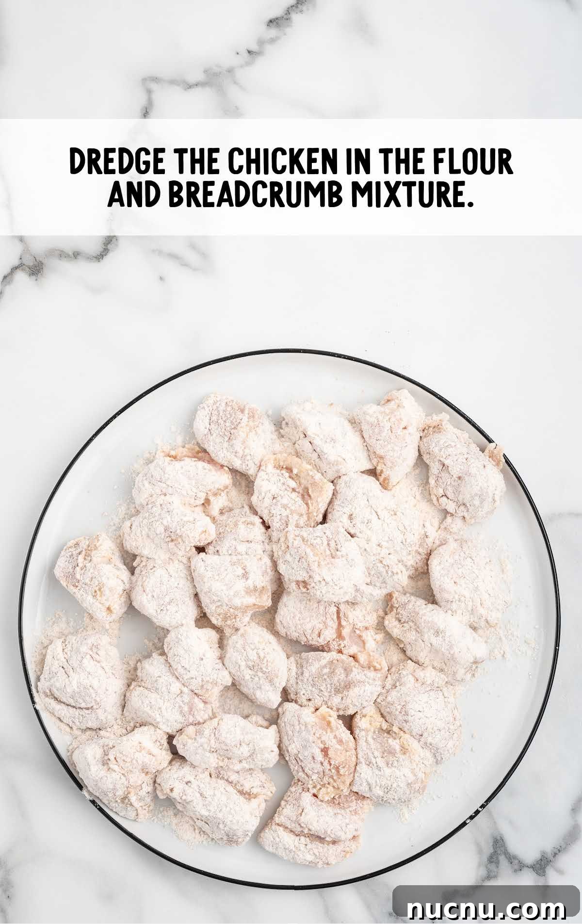 chicken nuggets coated in the flour and breadcrumb mixture