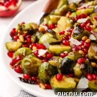closeup of.a dish served with roasted Brussels sprouts with pomegranates