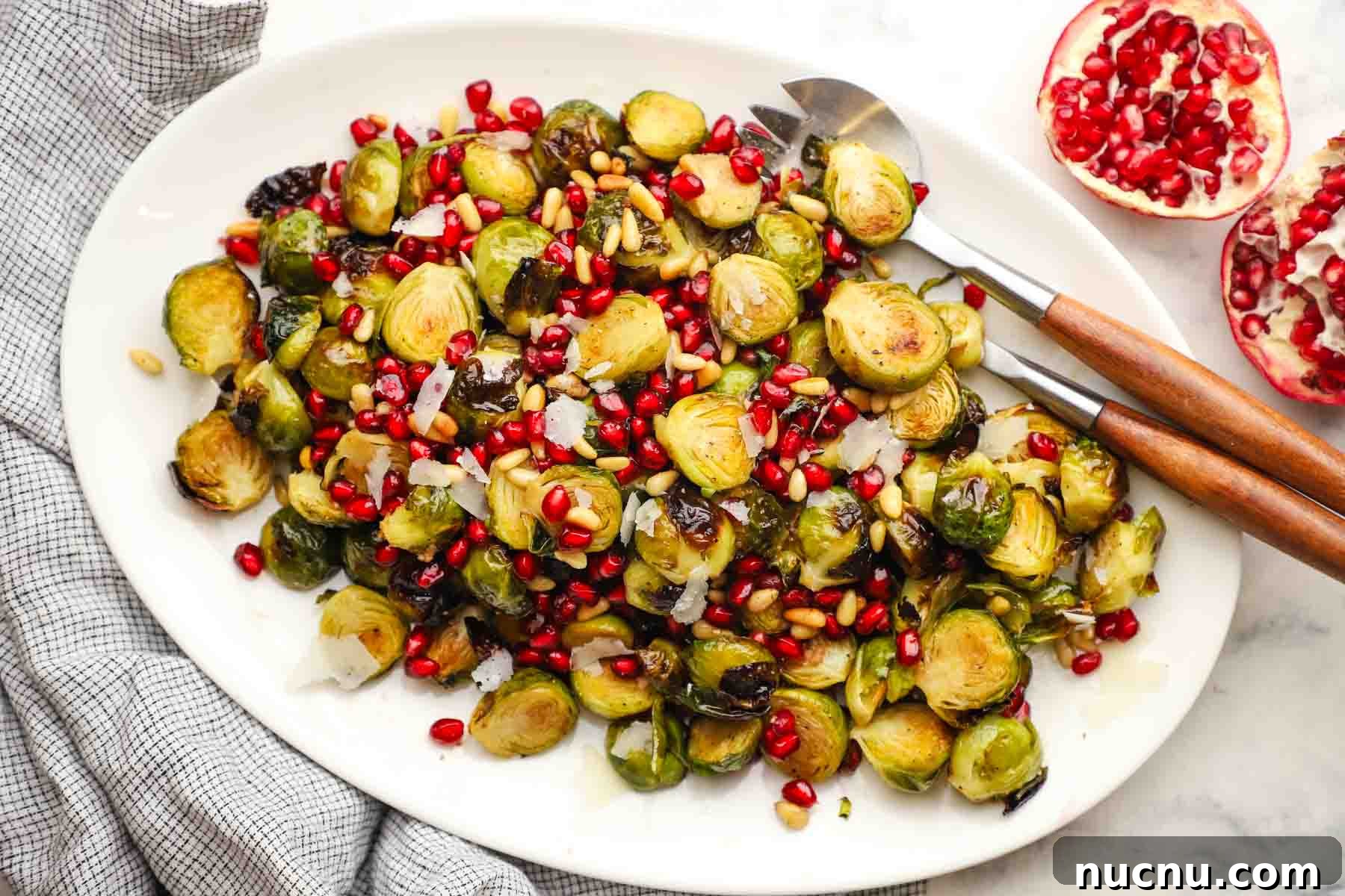 overhead view of a dish of roasted Brussels sprouts with pomegranates