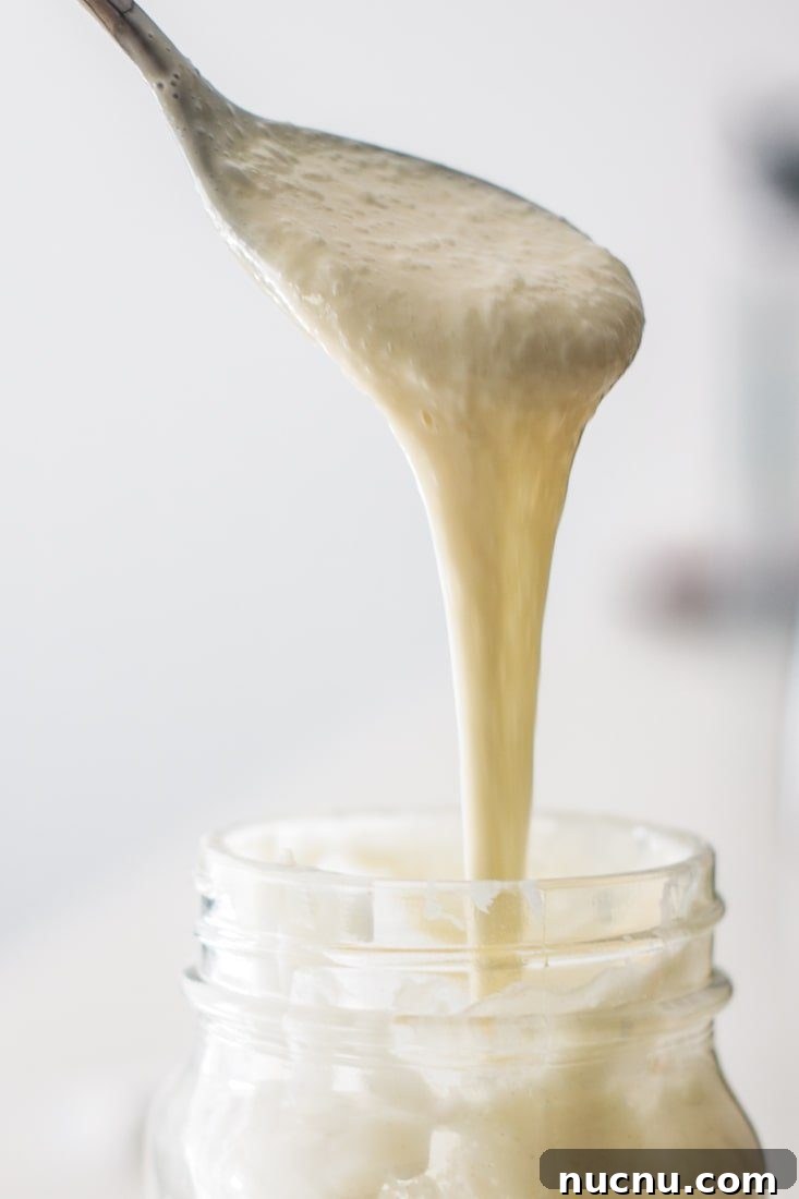 Spoon with sourdough starter.