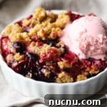 Mixed Berry Crisp topped with ice cream