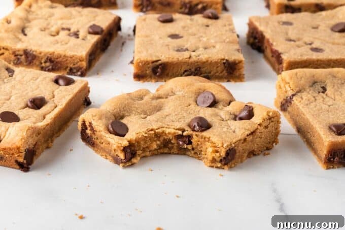 Chewy Peanut Butter Cookie Bars Recipe for Snack Lovers 3 peanut butter chocolate chip cookie bars with bite