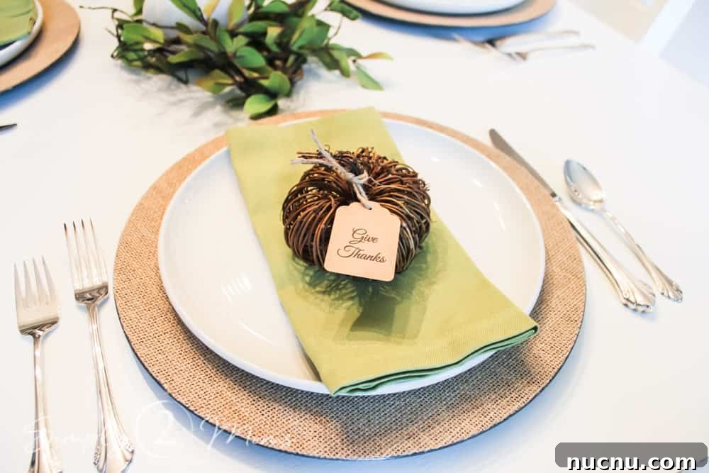 DIY Thanksgiving Place Cards: 3 Stylish Table Setting Ideas 4 close up of table setting with charger, folded napkin and mini grapevine pumpkin