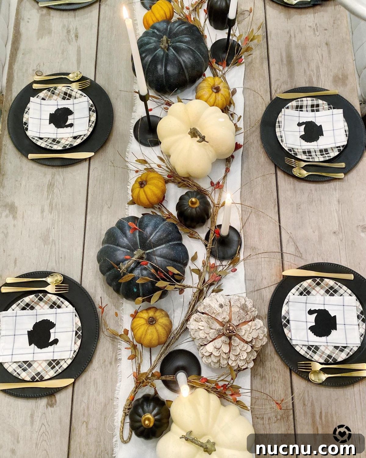 21 Stylish Thanksgiving Table Decor Ideas That Wow Guests 23 21. A Variety of Pumpkins and Elegant Candles